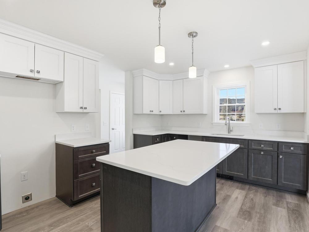 Clean kitchen surfaces that highlight cabinetry and layout
